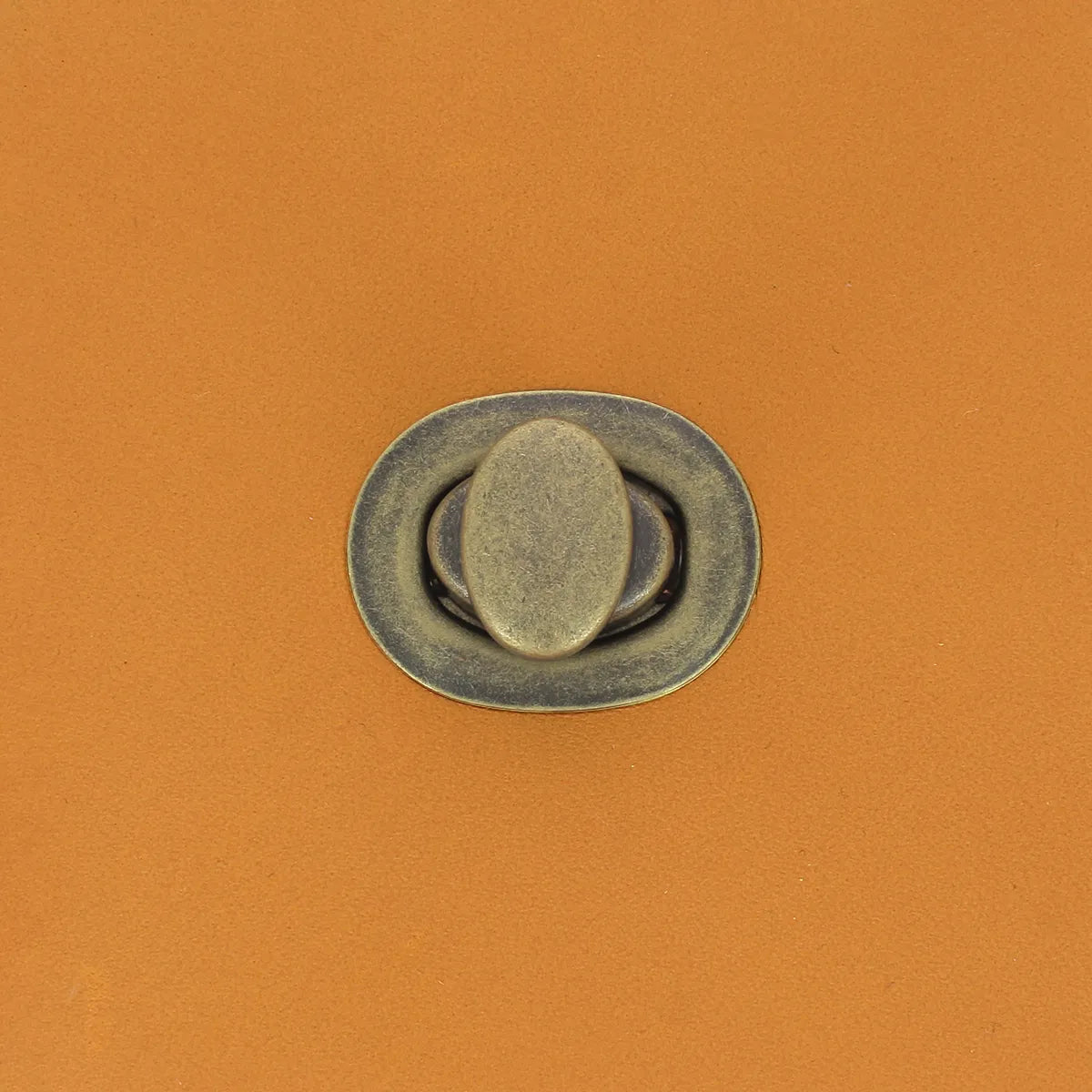 Fermoir tourniquet pour sac - ovale, laiton vieilli