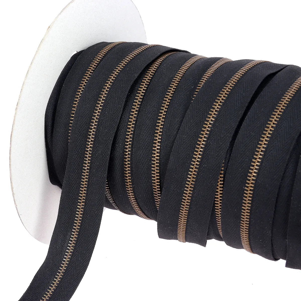Fermeture éclair au mètre largeur 4 mm finition laiton vieilli ruban noir