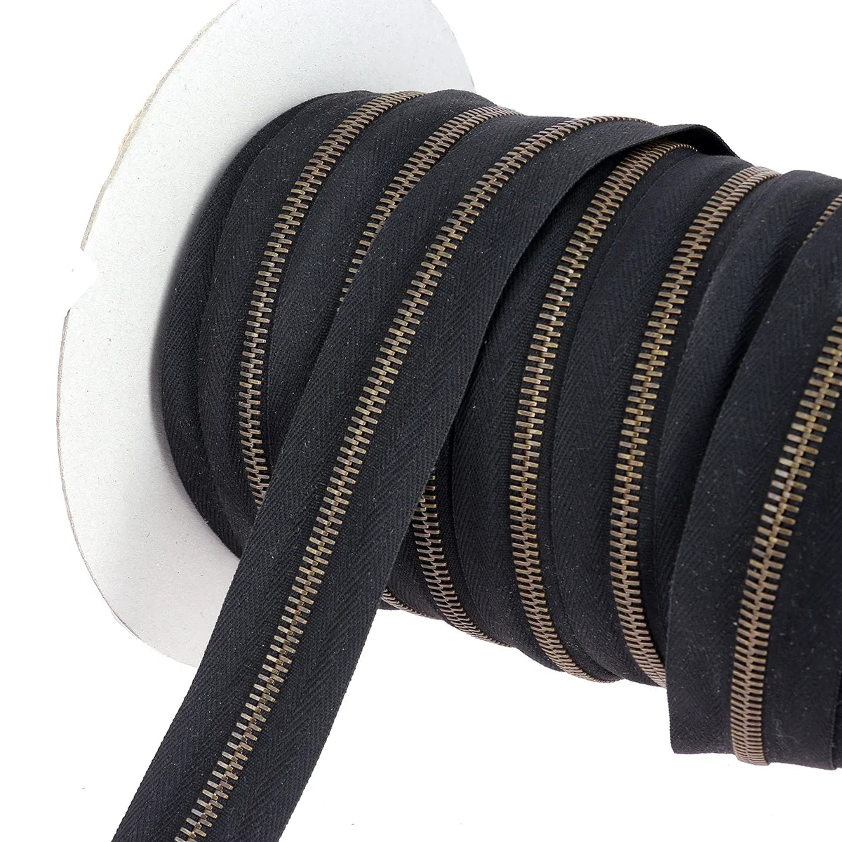 Fermeture éclair au mètre largeur 6 mm finition laiton vieilli ruban noir
