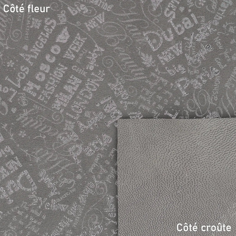 Peau de cuir gris taupe argenté motif voyage