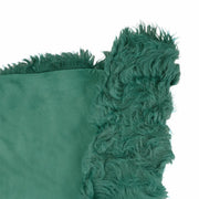 Cuir de mouton lainé à poils longs et frisés couleur vert canard. Cuir original pour des créations à la fois douces et uniques.