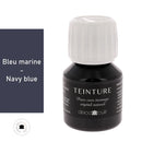 Teinture à base aqueuse Deco Cuir en bleu marine pour cuir, appliquée sur une surface en cuir.
