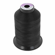 Bobine de fil polyester noir GRAL N°20 Coats, 600m, mercerie pour couture et broderie, vue de côté sur la bobine.
