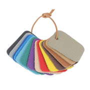 Échantillons de cuir Deco Cuir en granite, 14 pièces, montrant textures et couleurs variées pour choix de matériaux.